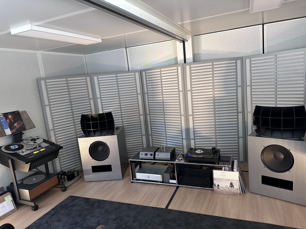 The first thing you see as you walk up to the entrance is a grey painted double sea container housing the Devon Ojas system. An air-conditioned environment showing off Devon Turnbull's take on the very in vouge of Japanese listening bar hi-fi. Minimalist / old school large speakers with flared horns. Very impressive.
