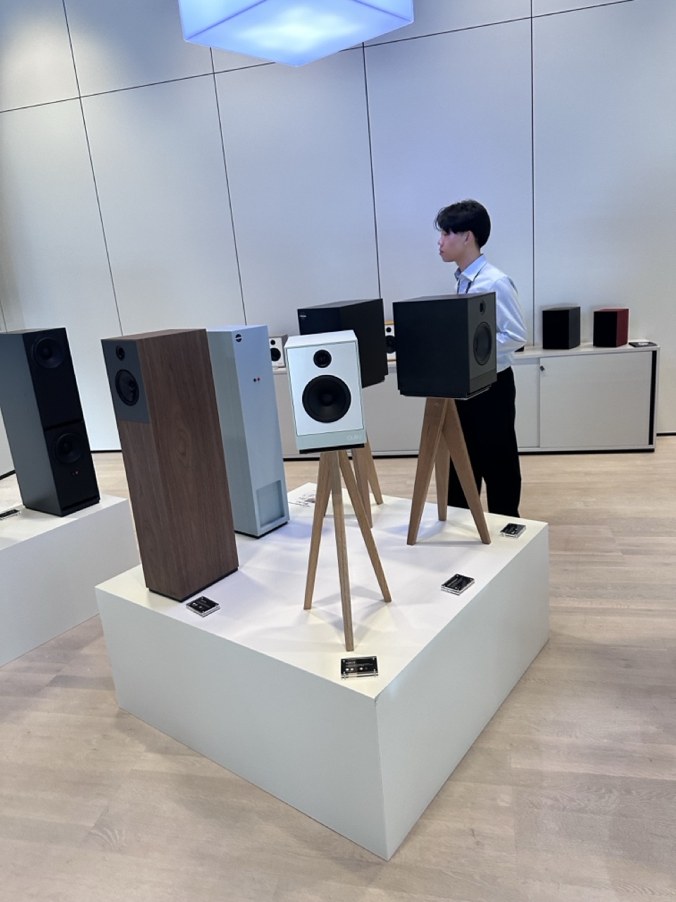 A nod to Danish furniture design holding aloft these simply design Guru 8 speakers.