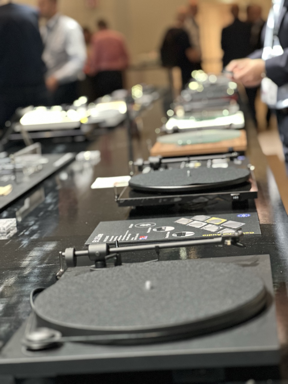 A whole lot of record players in the huge Project room.